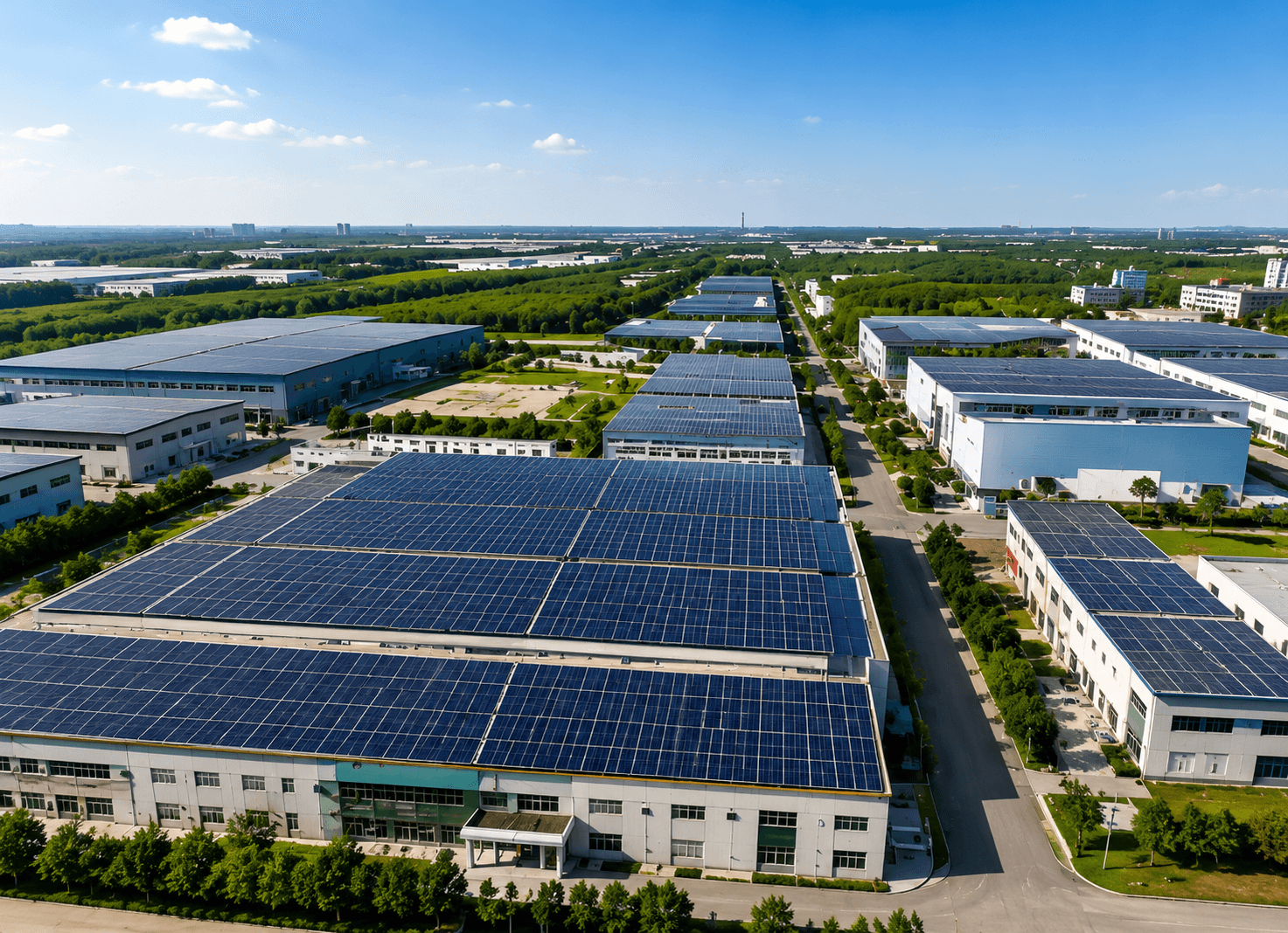Aerial view of an industrial park with rooftop solar installations